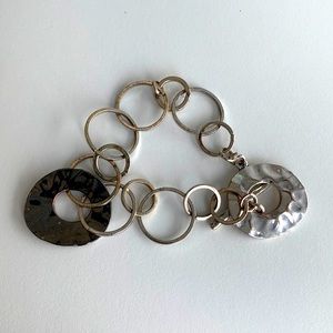 Silver tone metal disc bracelet with toggle clasp